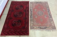 Red and pink rugs side by side on a beige floor