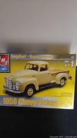 Front image of AMT 1950 Chevrolet Pickup model kit box showing painted truck image and branding