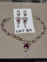 earrings and partial necklace full view