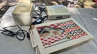Lot overview showing Star SP200 printer, GE radio, Salton H-928 food warmer box and cables