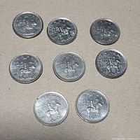Eight Canadian Mountie quarters reverse side