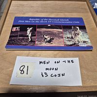 Front of presentation card for Marshall Islands First Men on the Moon $5 coin