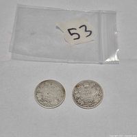 Two 1907 Canadian silver quarters with bag