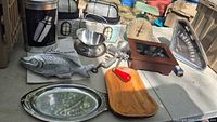 All items on table including lantern boxes, scale, trays, grinder, board, odometer