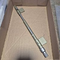 Full view of parallax measuring bar inside box