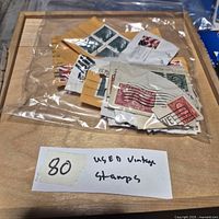 Bag filled with clipped used stamps on paper