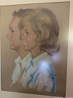 Pastel portrait of a man and woman in profile, signed dated 1975