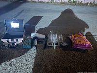 Photo showing all items in the lot including mini storage boxes, hair dryer, hair curlers, cosmetic organizer, mini silver picture frames, and bag of hair twist curlers