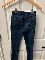 Back view of Children's Place super skinny jeans showing elastic waistband and rear pockets.