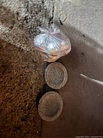 Two crackle design decorative plates and a clear plastic bag containing decorative balls.
