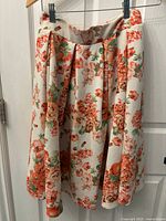 Front view of floral pleated skirt by Have Motive, showing fabric pattern and pleat details