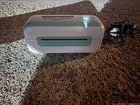 Mini label printer front view showing label output slot and overall condition