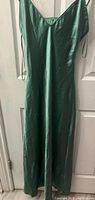 Front view of a green silk gown size X-Small showing full length and V-neckline with straps.