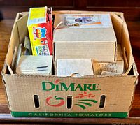 Box containing multiple smaller boxes and packs of vintage sports cards including Topps and Score brands