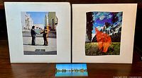 Front and back cover of Pink Floyd 'Wish You Were Here' vinyl record album along with a postcard.