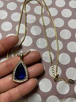 Pendant and chain front view in hand