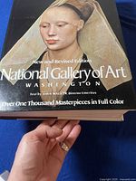 Close-up of book cover showing the title, artwork, and edition details.