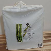 Photo of the sheet set packaging showing product label with bamboo design and product details.
