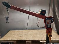 Full side view of the folding truck crane assembled on table