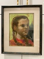 Full view of the framed pastel portrait of a girl. Signature visible at bottom left.