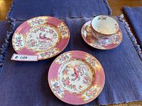 All four pieces arranged: 8-inch plate, 6-inch plate, teacup and saucer