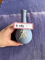 Top view of the blue jasperware vase showing the white cherub relief detail.