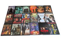 Top-down view of all 18 DVD cases laid out showing cover artwork and titles.