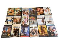 Photo showing the 18 DVDs laid out in three rows displaying covers from movies starring Tom Hanks and John Travolta.