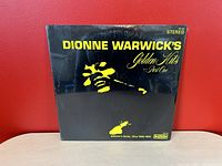 Front cover of Dionne Warwick's Golden Hits Part One vinyl record album sealed in original plastic cover.