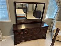 Front view of dresser with attached mirror showing finish and overall design
