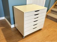 White IKEA Alex drawer unit on caster wheels showing front and side with closed drawers.