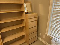 Frontal view of chest showing six drawers and mirror panel folded down