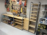 Full view of assembled shelving system showing bench modules, drawer chest and tall shelving unit