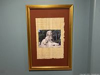 Full view of the framed picture showing the photo of the Sphinx of Memphis mounted on papyrus inside a gold frame.