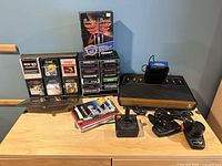 Overall lot with console, modules, controllers, games, manuals and power cord