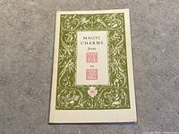 Front cover showing title and decorative frame in green with red text.