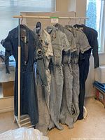 Full rack shot of six denim garments hung on clothing rack