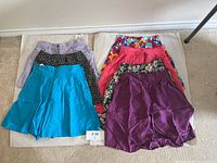 All 7 shorts laid out showing color and pattern variety