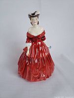 Front view of the Royal Doulton Vivienne figurine showing the red dress and off-shoulder neckline.