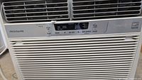Front view of the Frigidaire air conditioning unit showing control panel and vents.