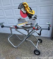 Front view of DeWalt miter saw mounted on Bosch stand