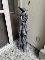 Photo showing full height and draping detail of Paverpol lady sculpture near door