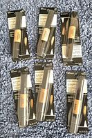 Six new Covergirl Trublend Itm Lip makeup products in original packaging on a grey textured surface.