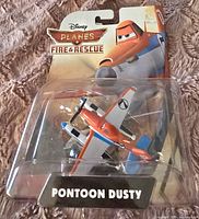 Photo of new, unopened Disney Planes Fire & Rescue Pontoon Dusty toy plane in original packaging.