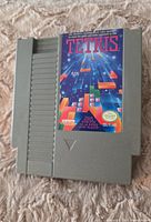 Front view of the NES Tetris game cartridge showing full label artwork and cartridge body.