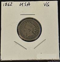 Obverse side of 1862 US Indian Head Penny showing Native American head with feather headdress and date