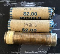 Two brown paper wrapped rolls labeled 1920s and 1930s $2.00 Nickels