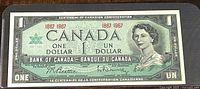Full view of the 1967 Canadian one dollar banknote showing portrait of Queen Elizabeth II and bilingual denomination text.