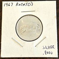 Front side of the coin showing the detailed image of a cougar walking, labeled to show it is a 1967 silver coin with .8000 silver content.