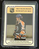 Front side of the Wayne Gretzky 1980-81 O-Pee-Chee NHL trading card showing image and text of his record-breaking assists.